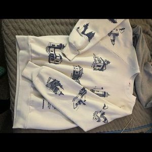 Medium. White crew neck sweater. Navy Blue light houses on it.